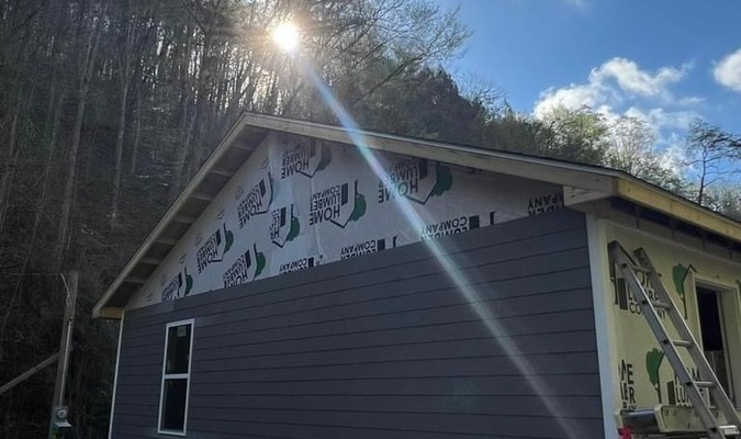 The Housing Development Alliance (HDA) recently installed siding on a home in Breathitt County for a flood survivor.
